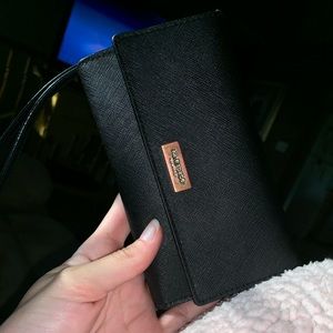 Black Kate Spade wristlet.